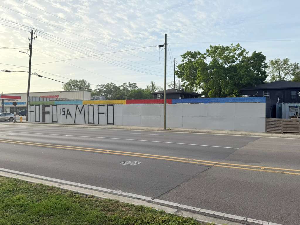 FOFO IS A MOFO painted on building wall in Biloxi, Mississippi